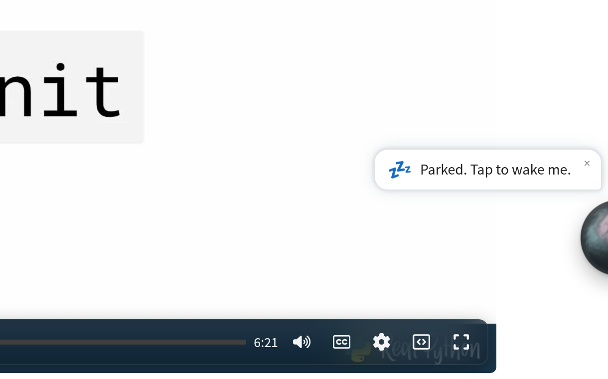 A video player with a Parked. Tap to wake me. tooltip next to the dimmed Mentor AI orb at the edge of the screen